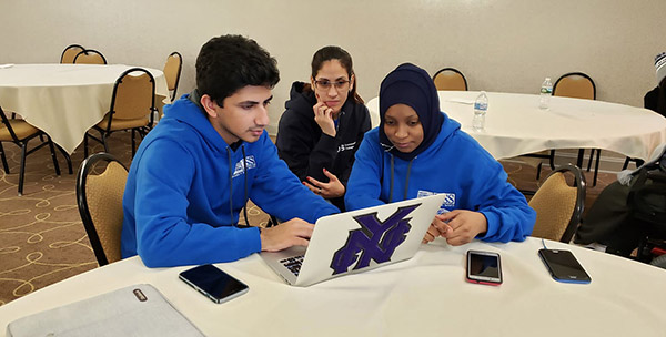 Students working together on a laptop